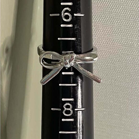 NWT Bow Ring- 14K White Gold
Plated Zinc Alloy. Great for Any Day! MSRP $27.99 - Picture 5 of 6